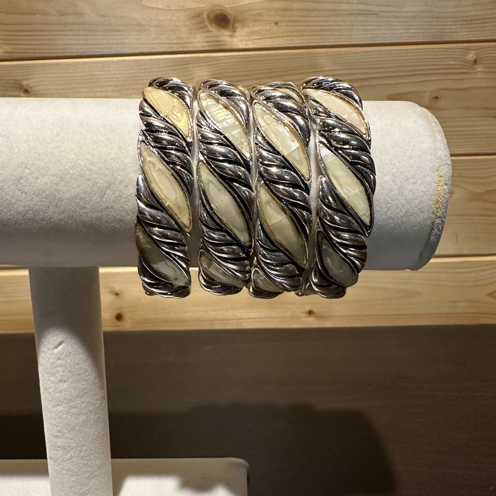 Four stackable ivory and silver stretch bracelets